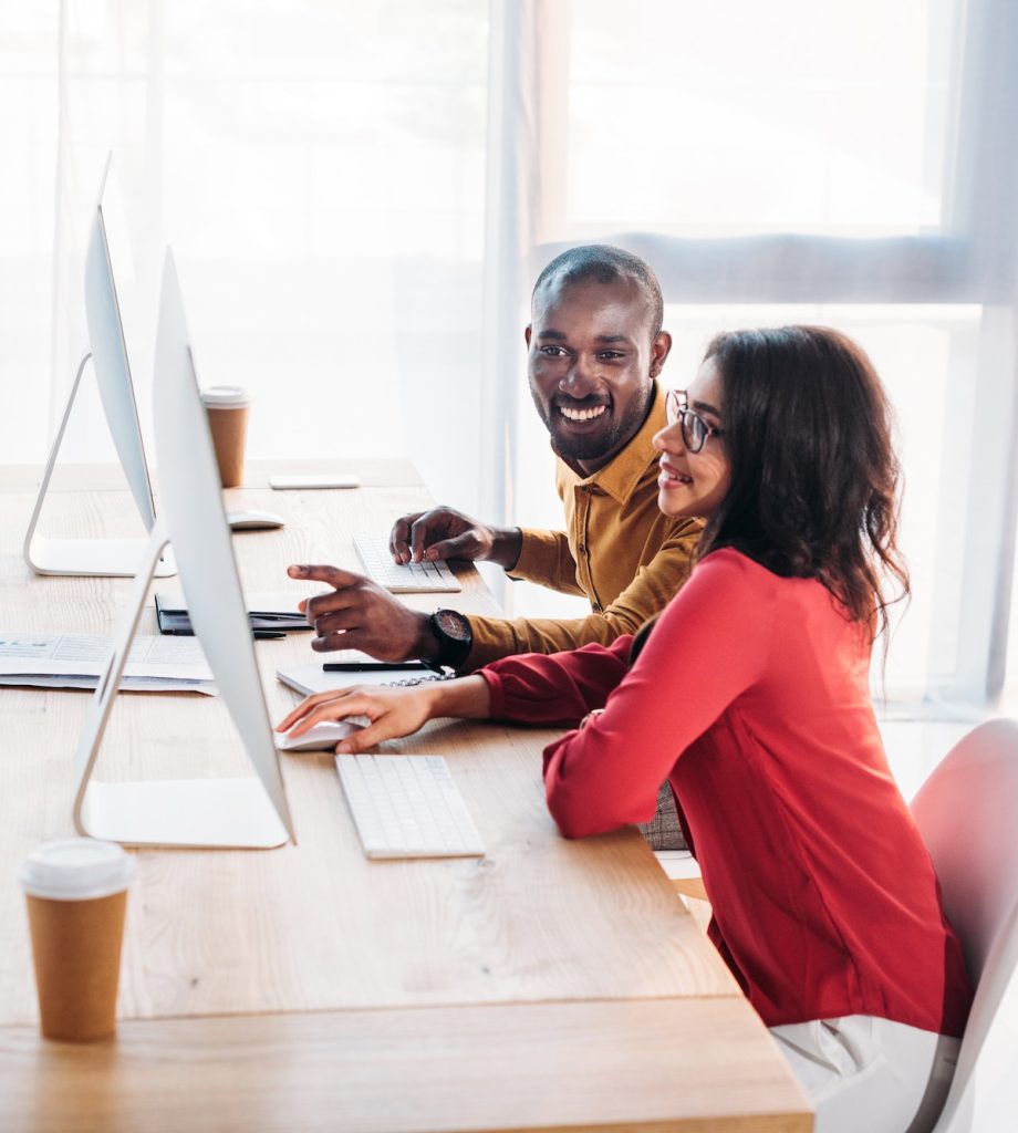 side view of african american business people working at workplace in office